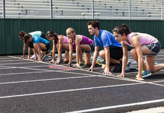 students lined up on track